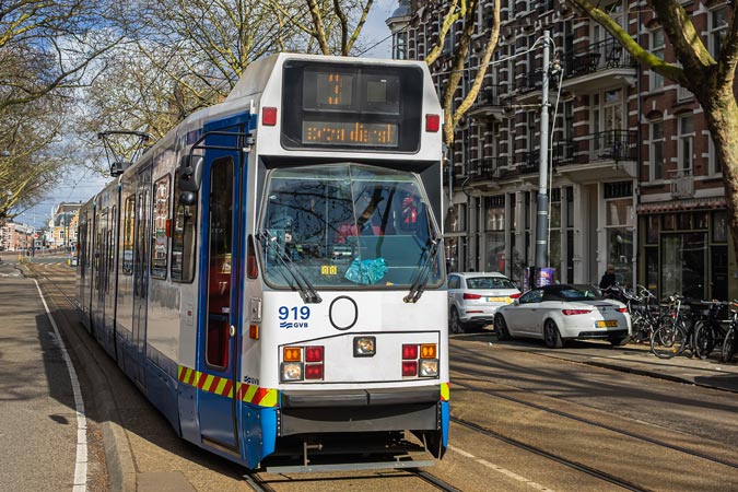Amsterdam. Both modern and historical trams on route. Unbreakable Ukrainian women